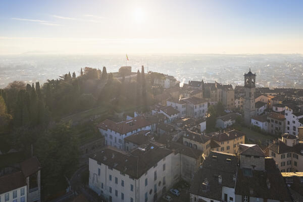 View of the rooftops, churches and towers of the Upper Town (Città Alta) of Bergamo city at sunrise. Bergamo, Lombardy, Italy.