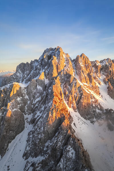 Aerial view of the Pizzo Camino mount at sunset in winter. Schilpario, Val di Scalve, bergamo district, Lombardy, Italy.