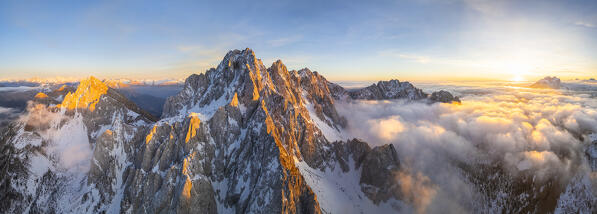 Aerial view of the Pizzo Camino mount at sunset in winter. Schilpario, Val di Scalve, bergamo district, Lombardy, Italy.