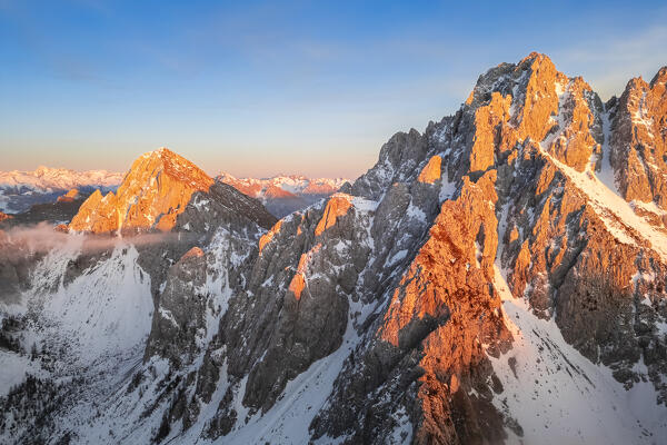 Aerial view of the Pizzo Camino mount at sunset in winter. Schilpario, Val di Scalve, bergamo district, Lombardy, Italy.