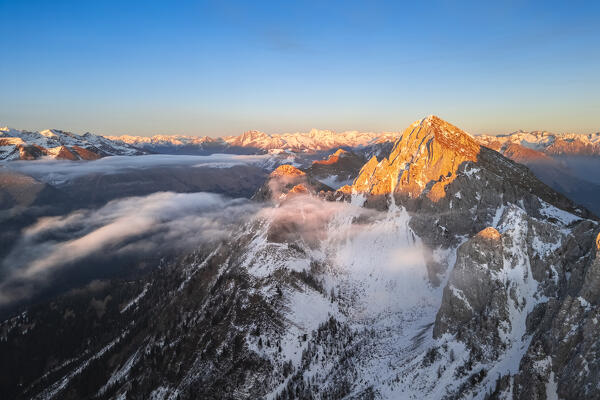 Aerial view of the Monte Sossino mount at sunset in winter. Schilpario, Val di Scalve, bergamo district, Lombardy, Italy.
