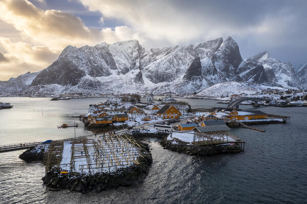 Aerial view of the Sakrisøya island and Reine Bay towards Reinebringen in winter, Lofoten Islands, Norway.
