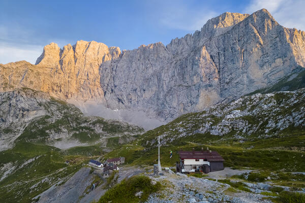 Aerial view of the Albani refuge and the north face of the Presolana at dawn. Val di Scalve, Bergamo district, Lombardy, Italy, Southern Europe.