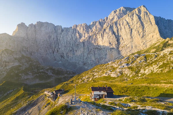 Aerial view of the Albani refuge and the north face of the Presolana at dawn. Val di Scalve, Bergamo district, Lombardy, Italy, Southern Europe.