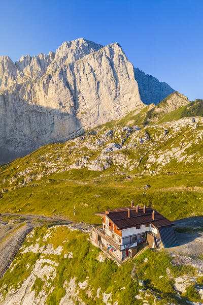 Aerial view of the Albani refuge and the north face of the Presolana at dawn. Val di Scalve, Bergamo district, Lombardy, Italy, Southern Europe.