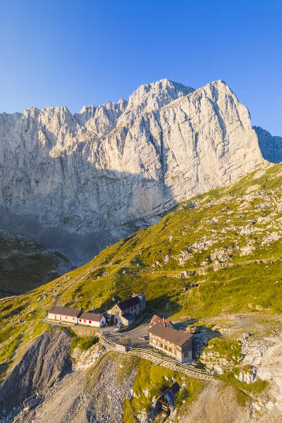 Aerial view of the Albani refuge and the north face of the Presolana at dawn. Val di Scalve, Bergamo district, Lombardy, Italy, Southern Europe.