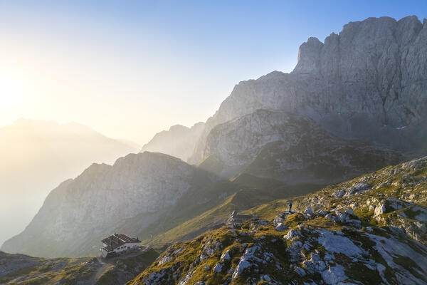 Aerial view of the Albani refuge and north face of the Presolana at sunrise. Val di Scalve, Bergamo district, Lombardy, Italy, Southern Europe.