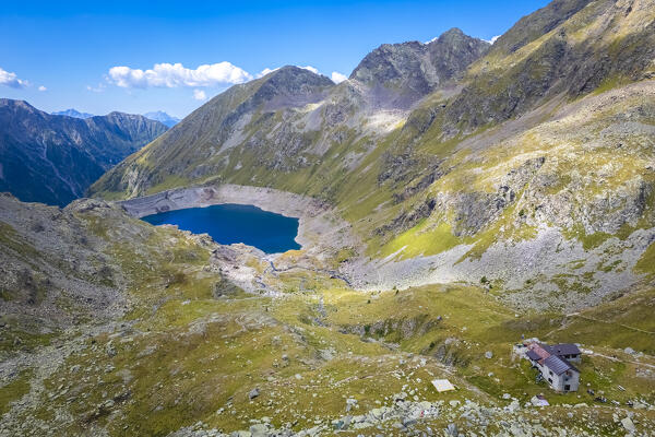 View of the Franco Tonolini refuge and Lake Rotondo in the beautiful Val Miller. Sonico, Val Camonica, Brescia district, Lombardy, Italy.