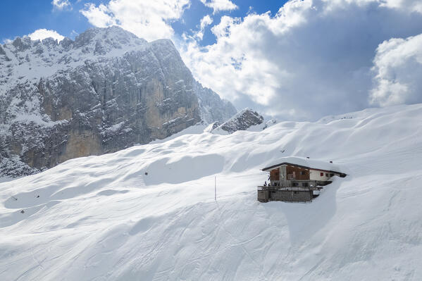 Aerial view of the Albani refuge and the north face of the Presolana in winter. Val di Scalve, Bergamo district, Lombardy, Italy, Southern Europe.