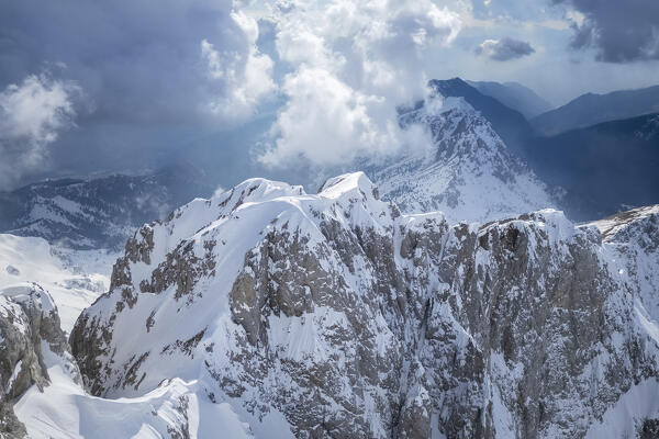 Aerial panorama of the Presolana mountain from above, covered in snow in winter. Val di Scalve, Bergamo district, Lombardy, Italy, Southern Europe.