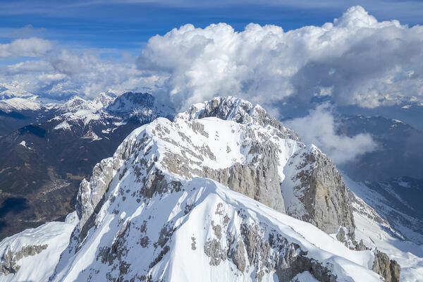 Aerial panorama of the Presolana mountain from above, covered in snow in winter. Val di Scalve, Bergamo district, Lombardy, Italy, Southern Europe.