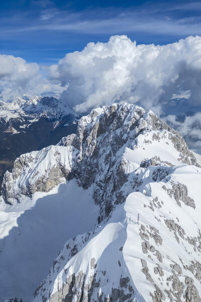 Aerial panorama of the Presolana mountain from above, covered in snow in winter. Val di Scalve, Bergamo district, Lombardy, Italy, Southern Europe.