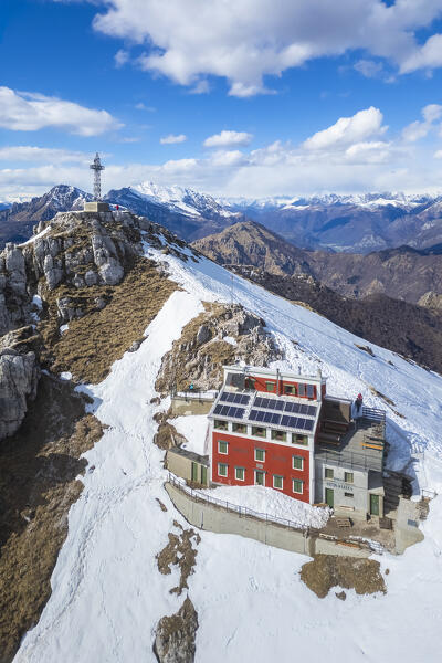 Aerial view of the top of Monte Resegone and Rifugio Azzoni in winter. Lecco, Lombardy, Italy, Europe.