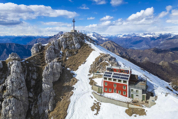 Aerial view of the top of Monte Resegone and Rifugio Azzoni in winter. Lecco, Lombardy, Italy, Europe.