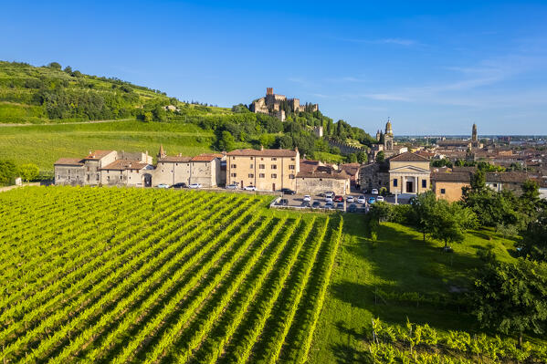 Aerial view of the Santuario di Santa Maria alla bassanella and the Scaligero castle of Soave in the distance. Verona district, Veneto, Italy, Europe.