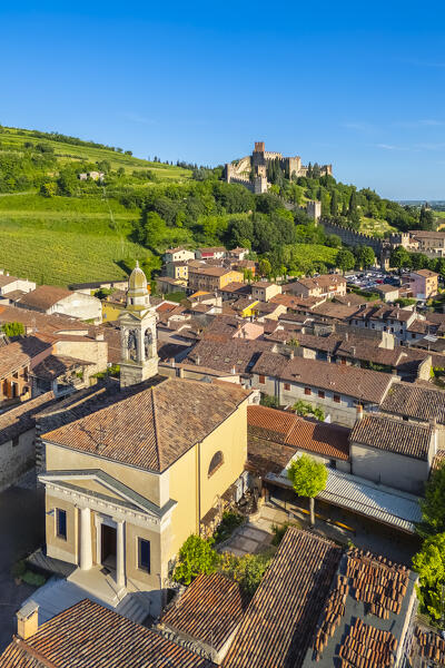 Aerial view of the Santuario di Santa Maria alla bassanella and the Scaligero castle of Soave in the distance. Verona district, Veneto, Italy, Europe.
