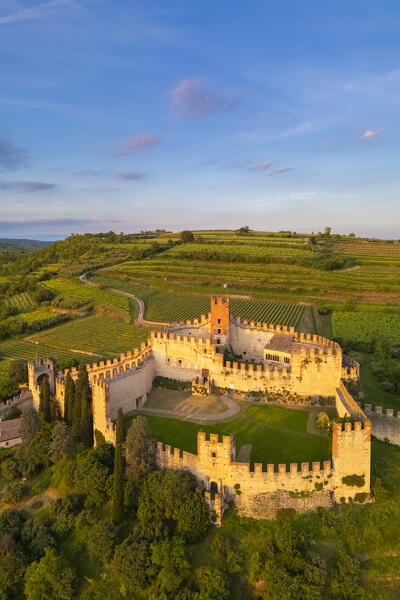 Aerial view of the Scaligero castle of Soave at sunset in summer. Verona district, Veneto, Italy, Europe.