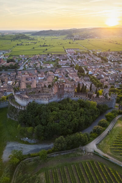 Aerial view of the Scaligero castle of Soave at sunset in summer. Verona district, Veneto, Italy, Europe.