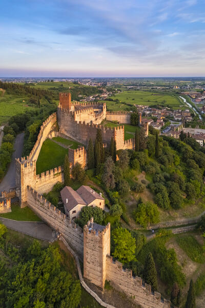 Aerial view of the Scaligero castle of Soave at sunset in summer. Verona district, Veneto, Italy, Europe.