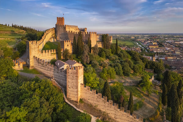 Aerial view of the Scaligero castle of Soave at sunset in summer. Verona district, Veneto, Italy, Europe.