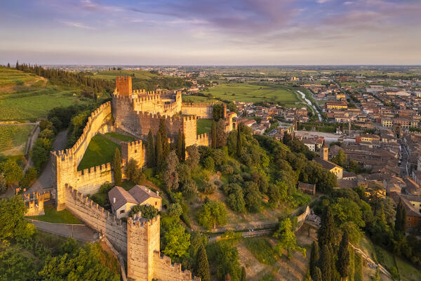 Aerial view of the Scaligero castle of Soave at sunset in summer. Verona district, Veneto, Italy, Europe.