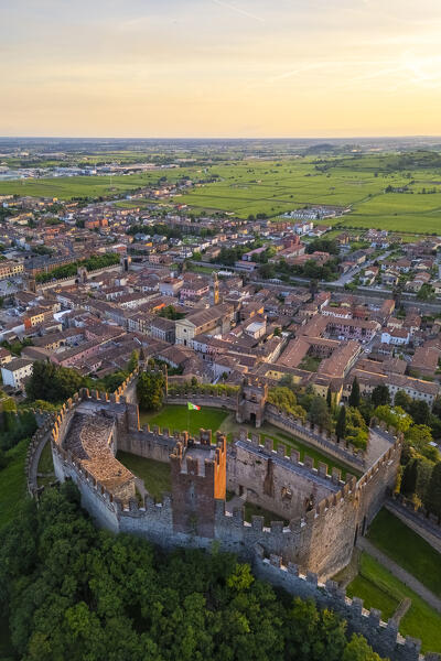 Aerial view of the Scaligero castle of Soave at sunset in summer. Verona district, Veneto, Italy, Europe.