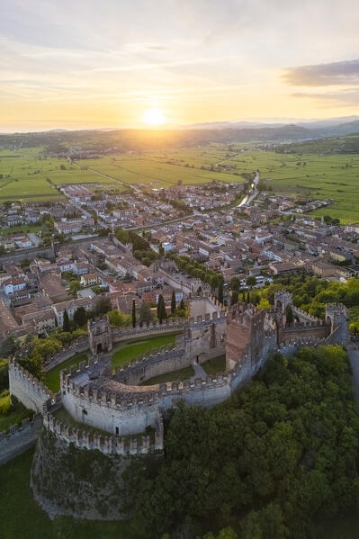 Aerial view of the Scaligero castle of Soave at sunset in summer. Verona district, Veneto, Italy, Europe.