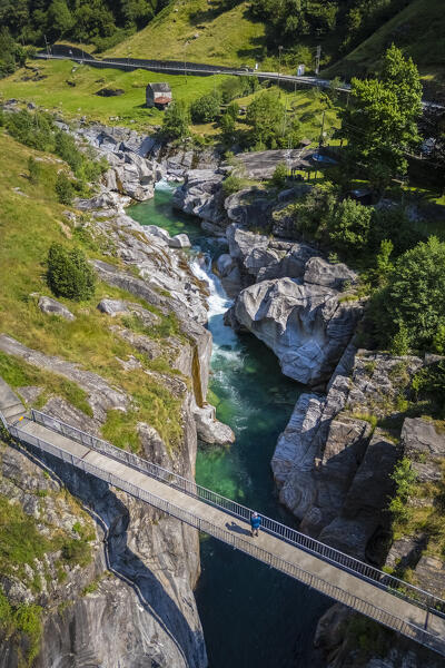 Aerial view of a small bridge over the emerald waters of river Verzasca. Verzasca, Verzasca Valley, Locarno, Canton Ticino, Switzerland, Western Europe.