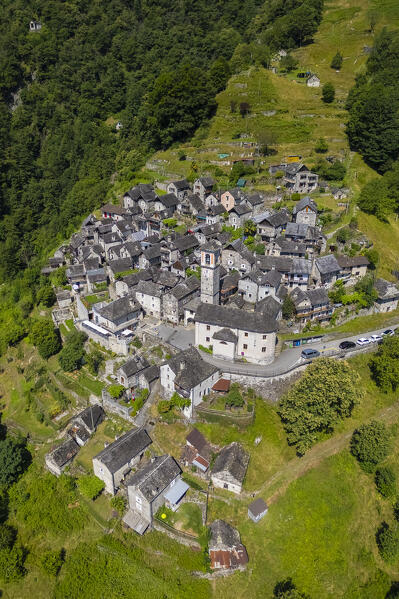 View of the town of Corippo, the town with less inhabitants of all Switzerland, and Lake Vogorno with Verzasca Dam. Corippo, Valle Verzasca, Canton Ticino, Switzerland.