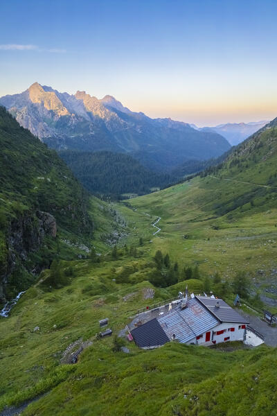 Aerial view of Longo refuge at dawn in summer. Carona, Val Brembana, Alpi Orobie, Bergamo, Bergamo Province, Lombardy, Italy, Europe.