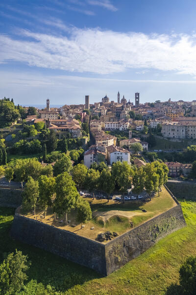 View of the rooftops, churches and towers of the Upper Town (Città Alta) of Bergamo city in summer. Bergamo, Lombardy, Italy.