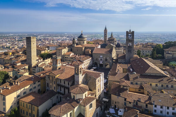 View of the rooftops, churches and towers of the Upper Town (Città Alta) of Bergamo city in summer. Bergamo, Lombardy, Italy.
