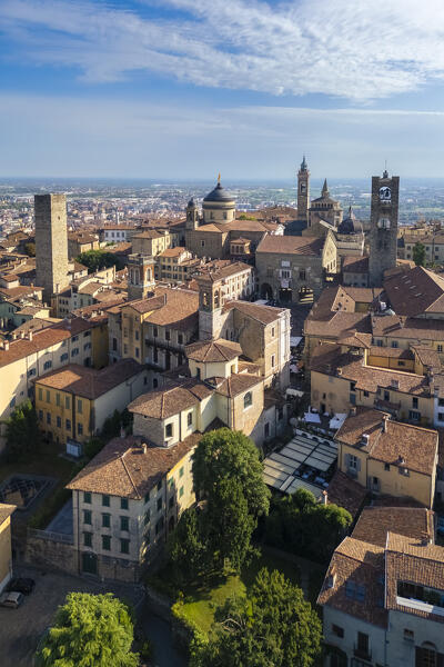 View of the rooftops, churches and towers of the Upper Town (Città Alta) of Bergamo city in summer. Bergamo, Lombardy, Italy.
