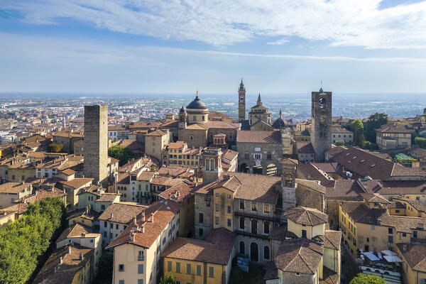 View of the rooftops, churches and towers of the Upper Town (Città Alta) of Bergamo city in summer. Bergamo, Lombardy, Italy.