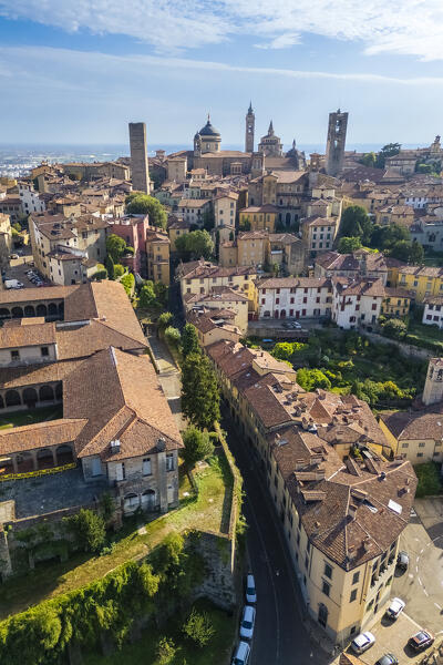 View of the rooftops, churches and towers of the Upper Town (Città Alta) of Bergamo city in summer. Bergamo, Lombardy, Italy.