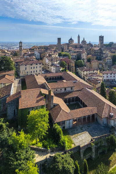 View of the rooftops, churches and towers of the Upper Town (Città Alta) of Bergamo city in summer. Bergamo, Lombardy, Italy.