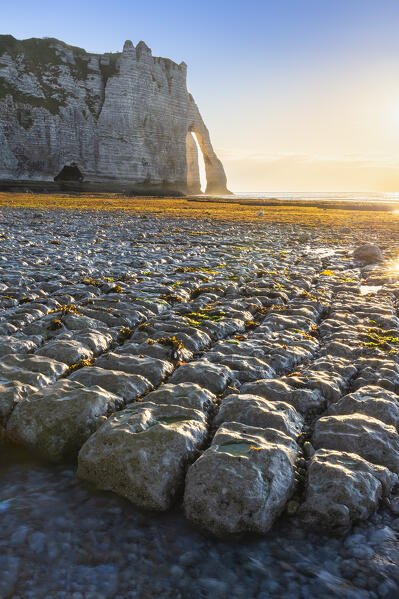 Sunset at the cliff and arch of Etretat, Octeville sur Mer, Le Havre, Seine Maritime, Normandy, France, Western Europe.