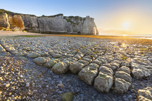 Sunset at the cliff and arch of Etretat, Octeville sur Mer, Le Havre, Seine Maritime, Normandy, France, Western Europe.