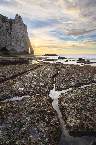 Sunset at the cliff and arch of Etretat, Octeville sur Mer, Le Havre, Seine Maritime, Normandy, France, Western Europe.