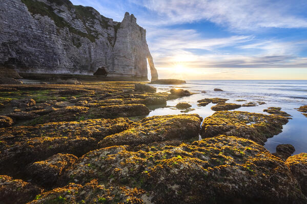 Sunset at the cliff and arch of Etretat, Octeville sur Mer, Le Havre, Seine Maritime, Normandy, France, Western Europe.