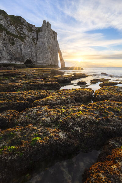 Sunset at the cliff and arch of Etretat, Octeville sur Mer, Le Havre, Seine Maritime, Normandy, France, Western Europe.