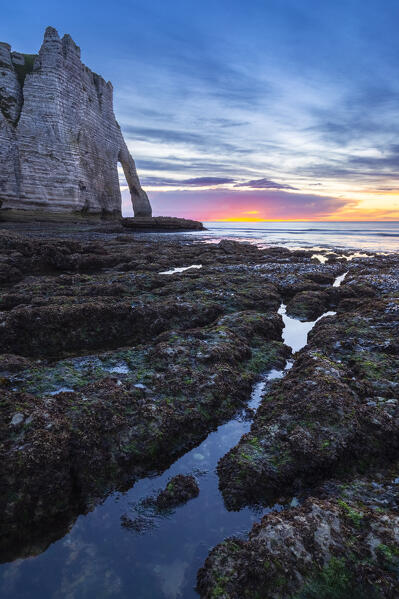 Sunset at the cliff and arch of Etretat, Octeville sur Mer, Le Havre, Seine Maritime, Normandy, France, Western Europe.