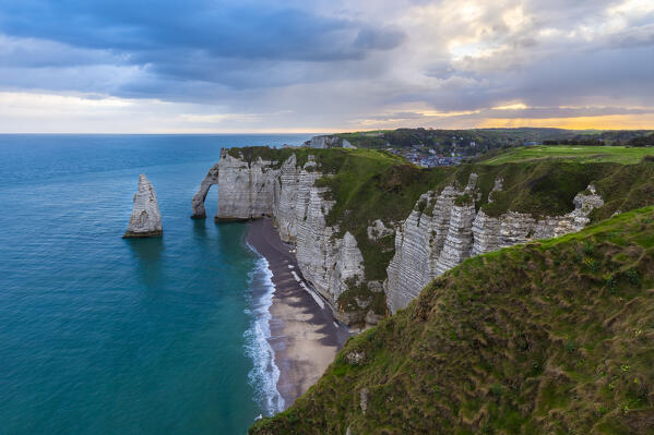 View of the arch and needle of Etretat at sunrise, Octeville sur Mer, Le Havre, Seine Maritime, Normandy, France, Western Europe.