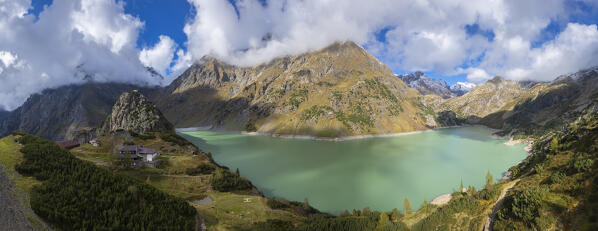 Aerial view of the artificial lake of Barbellino and Curò refuge. Valbondione, Seriana Valley, Lombardy, Bergamo province, Italy.