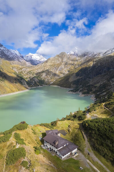 Aerial view of the artificial lake of Barbellino and Curò refuge. Valbondione, Seriana Valley, Lombardy, Bergamo province, Italy.