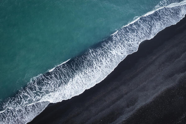 Aerial view of waves on the black sands of Reynisfjara beach. Vík í Mýrdal, Southern Iceland, Iceland, Northern Europe.
