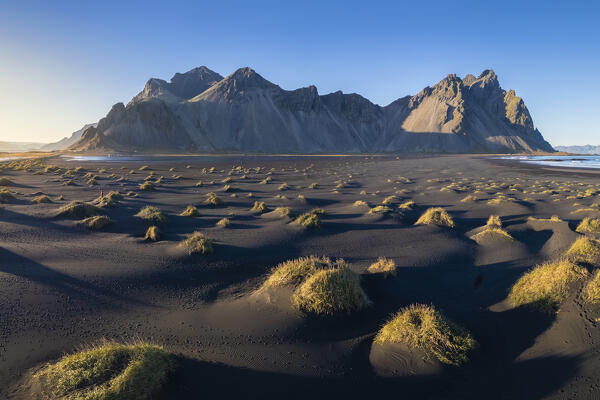 Aerial view of the black sand dunes in front of Vestrahorn mountain. Stokksnes peninsula, Hofn, Austurland, Iceland, Europe.