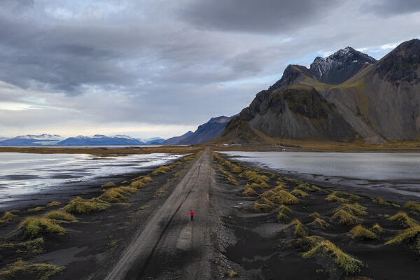 Aerial view of the black sand dunes in front of Vestrahorn mountain. Stokksnes peninsula, Hofn, Austurland, Iceland, Europe.