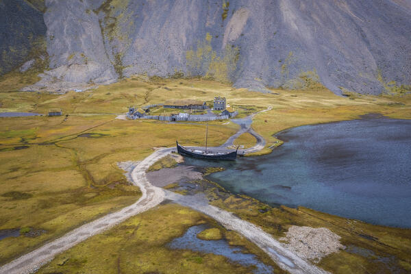 Aerial view of an abandoned Viking village film set in front of Vestrahorn mountain. Stokksnes peninsula, Hofn, Austurland, Iceland, Europe.
