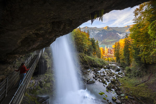 View of the Giessbach waterfalls and Grand Hotel in autumn at sunset. Iseltwald, Lake Brienz, Bernese Oberland, Interlaken-Oberhasli district, Canton of Bern, Switzerland.